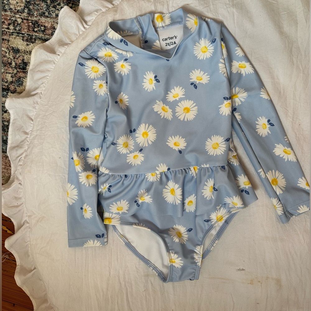 2T Carters long sleeve bathing suit. Never worn.